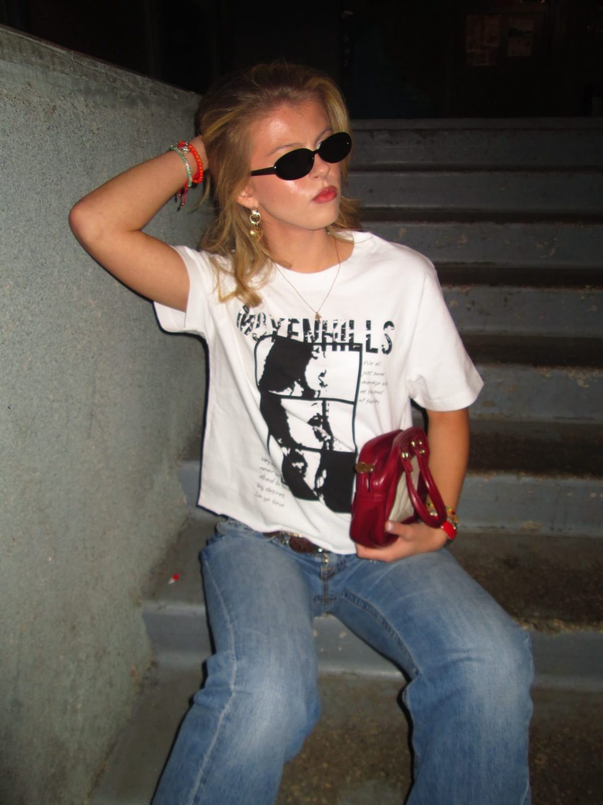 Model on concrete stairs wearing the ART WILL TEE